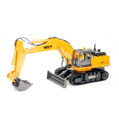 Huina RC pásový bagr s radlicí a kovovou lžící 1:16 Nová verze s majákem a figurkou